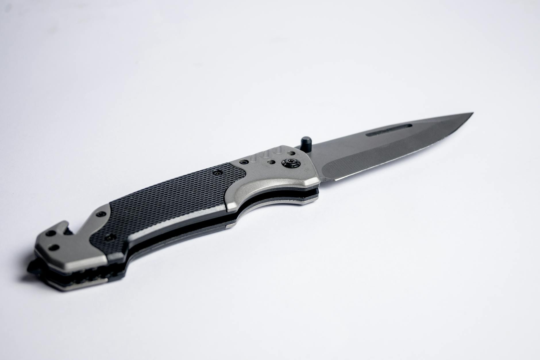 EDC pocket knife on white background