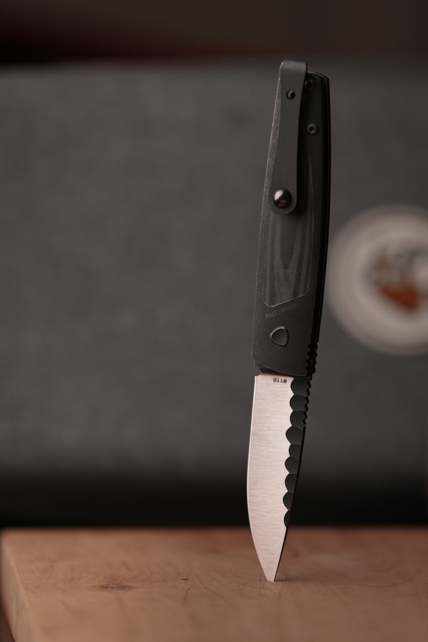 Serrated pocket knife edge close-up for OTF edge comparison